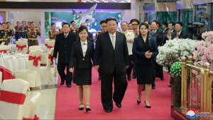 Kim Jong Un was also accompanied by his wife Ri Sol Ju, right, at a banquet to mark the 75th founding anniversary of the Korean People’s Army in North Korea Tuesday. (Korean Central News Agency/Korea News Service via AP)