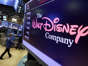 The Walt Disney Co. logo appears on a screen above the floor of the New York Stock Exchange. Disney is working on sequels for its "Toy Story," "Frozen" and "Zootopia" franchises as the company concentrates more on brands that have continued to perform well. AP Photo/Richard Drew, File