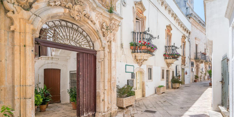 A labyrinth of white-washed houses with pretty balconies draped in flowers, Locorotondo is one of Italy's prettiest small towns.