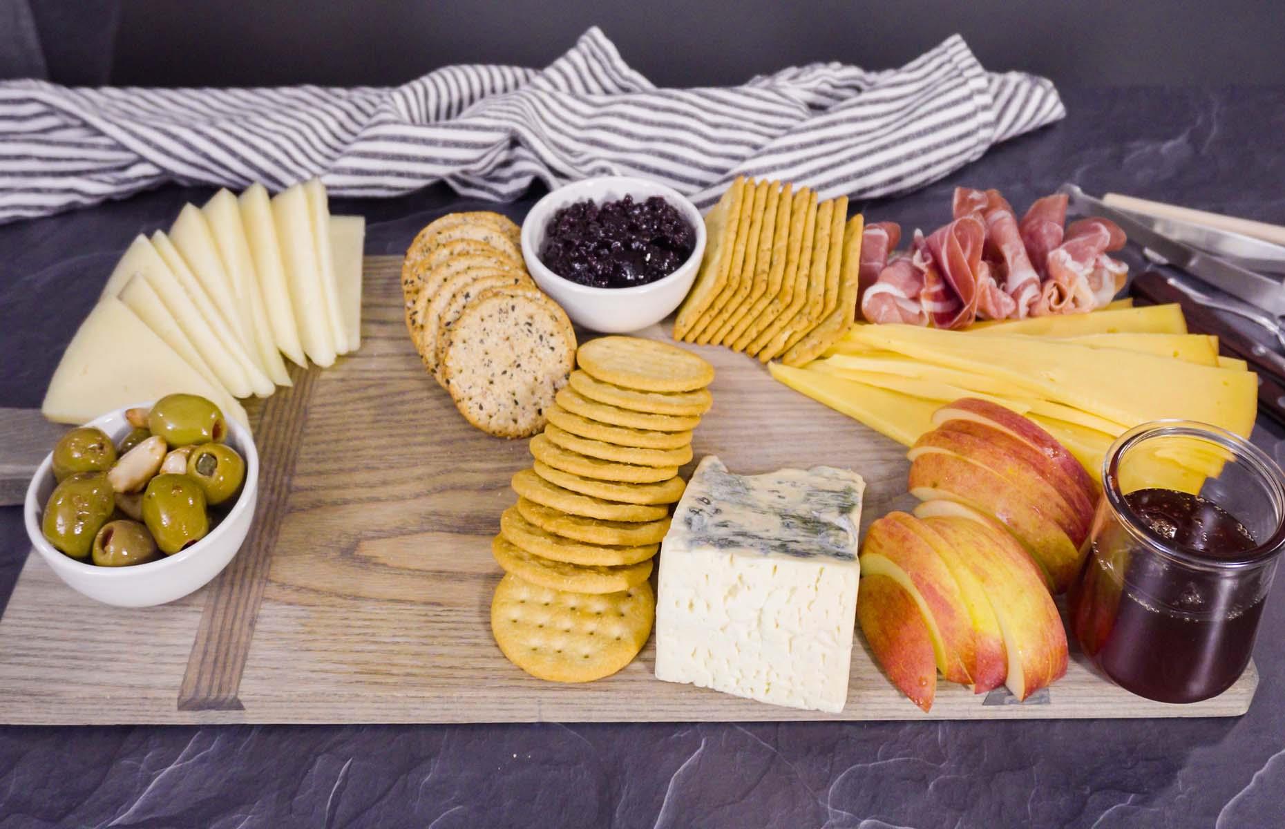 <p>For plenty of wow factor, it's important to fill your board with a variety of flavors, colors, shapes, and textures. If you're creating a cheeseboard, choose cheeses that look, feel, and taste significantly different. Slices of sharp Cheddar are really eye-catching when fanned; pair them with chunks of Parmesan for a crumbly mouthfeel, and a sweet and creamy Stilton to balance it all out. For a really unique platter, go to a cheesemonger and ask for small selections of cheeses to include. Ones flavoured with fruits and spices will work a charm, and you'll be surprised at the range you can find.  </p>