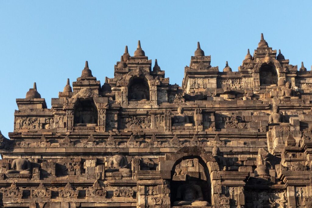 <p><em>By Victoria of Guide Your Travel</em></p> <p><a href="https://guideyourtravel.com/sunrise-at-borobudur-temple-in-yogyakarta-how-to-do-it-right/" rel="noreferrer noopener">Borobudur</a> is one of Indonesia's most important landmarks and is considered the largest Buddhist site in the world. Located around 1 hour from the city Yogyakarta in Central Jawa, this is a must-see for all types of tourists. </p> <p>Tickets cost around $25 per person and there are great student discounts available. It's highly recommended to visit the temple for sunrise, which means having to arrive before 5 am. You can access the grounds early through the Manohara Resort and enjoy incredible views of the surrounding volcanoes and the temple itself. </p> <p>Once the sun has risen, visitors are free to explore Borobudur and its grounds. Just make sure to dress appropriately and cover knees and shoulders since this is a religious site and all visitors need to be respectful. </p> <p>You don't really need to join a guided tour to see Borobudur but there are plenty available if you're looking for a more immersive experience. Don't forget to explore Yogyakarta after you've seen Borobudur, the city is really worth it.</p>