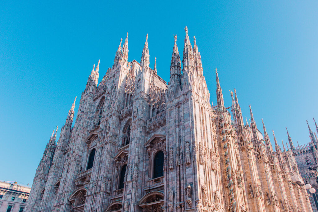 <p><em>By Or of My Path in the World </em></p> <p>Situated in the heart of Milan’s city center in <a href="https://wanderwithalex.com/visit-northern-italy/">northern Italy</a>, the Duomo di Milano (Milan Cathedral or Metropolitan Cathedral-Basilica of the Nativity of Saint Mary) is one of the largest churches in the world and certainly one of the most impressive.</p> <p>Comissioned by the Duke of Milan Gian Galeazzo Visconti in the 14th century, the Duomo took more than half a millennium to complete. It is not only an important religious site but also the last resting place of several members of the Visconti dynasty.</p> <p>Built mostly in Gothic style with countless intricate details on the inside and out, it challenged dozens of Italian architects and engineers throughout the centuries. Even Leonardo da Vinci competed for a chance to design a small portion of the cathedral.</p> <p>Different types of tickets will give you access to different parts of the Duomo, from the stunning rooftop overlooking the piazza to the intriguing underground archaeological area to the cathedral itself, making its indoor sights a fantastic place to <a href="https://mypathintheworld.com/things-to-do-in-milan-when-it-rains/" rel="noreferrer noopener">visit in Milan</a> on a rainy day.</p>