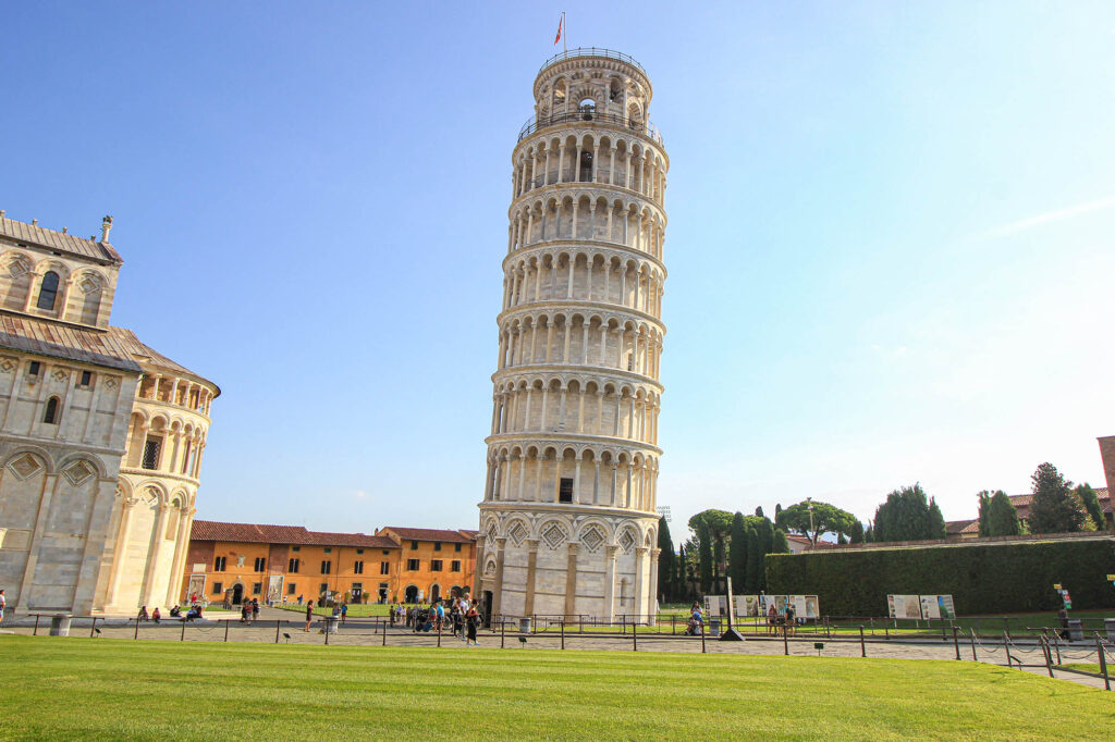 <p><em>By PlacesofJuma</em></p> <p>One of the most special landmarks in the world is definitely the famous Leaning Tower of Pisa, a true must-see at least once in your life! This spectacular sight is located in <a href="https://www.placesofjuma.com/things-to-do-in-pisa/" rel="noreferrer noopener">Pisa – Tuscany</a>, which also has an international airport if you want to travel by plane.</p> <p>The Leaning Tower of Pisa, built between 1173 and 1372, had already become skewed at that time. Many years later, between 1990 and 2001, this freestanding bell tower was forced to close due to its unsafe slope, which required an extensive maintenance. Finally, the tower has been straightened by 4 degrees; yet, the tower remains obviously bent, as seen in all classic photos about the Leaning Tower of Pisa.</p> <p>The Leaning Tower of Pisa is a UNESCO World Heritage Site, together with the Cathedral, Baptistery, and Cemetery, all of which are located on Piazza dei Miracoli. Admission to Piazza dei Miracoli is free, as is photographing the Leaning Tower. Climbing to the top of the tower, on the other hand, is a one-of-a-kind experience since the view from the top is stunning. </p> <p>Because the Leaning Tower is one of <a href="https://wanderwithalex.com/visit-central-italy/">central Italy’s</a> most famous attractions, there is usually a large line to climb it. As a result, it is strongly advised to get your tickets a few days before!</p>