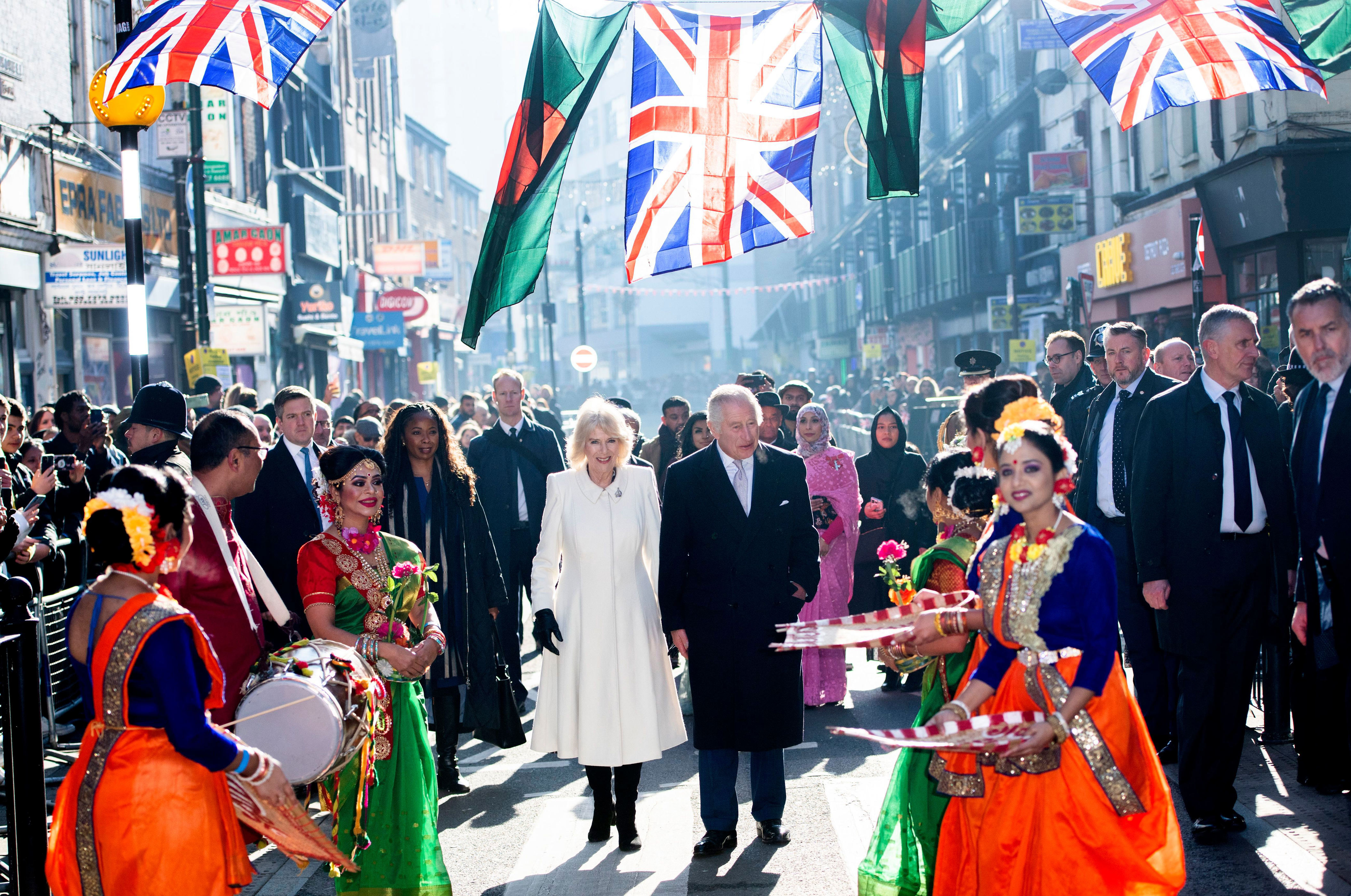 <p>King Charles III and Queen Consort Camilla visited Brick Lane in London on Feb. 8, 2023, where they chatted with members of the city's Bangladeshi community, planted a tree and received a takeout meal from a South Asian restaurant.</p>
