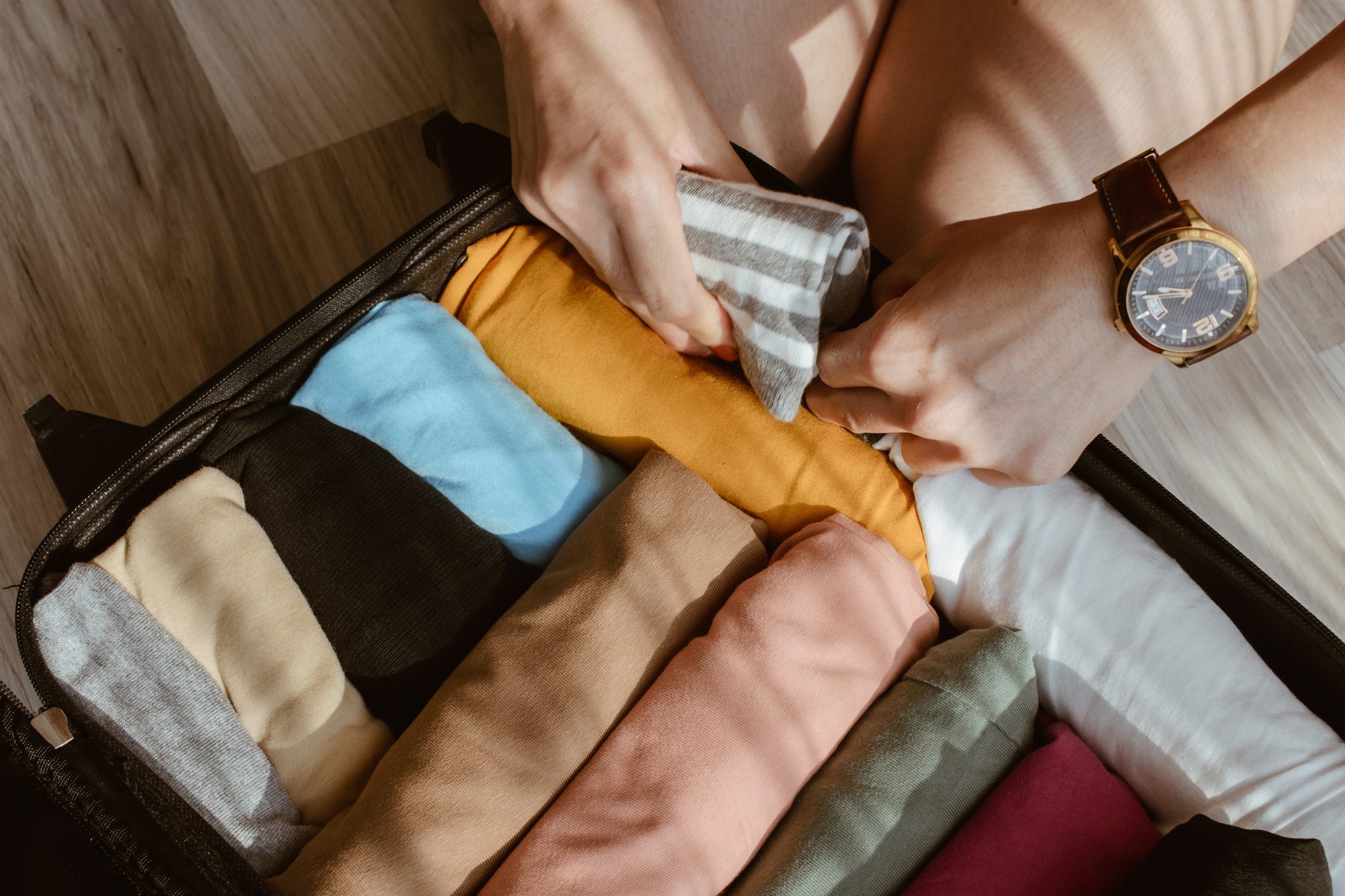 <p>Folding clothes that could be rolled is one of the most common <a href="https://www.rd.com/list/packing-mistakes/" rel="noopener noreferrer">packing mistakes</a> travelers make. Tightly roll items such as T-shirts, pajamas, casual pants and dresses to optimize suitcase space and avoid creasing. Roll heavy items (such as jeans) first and place at the bottom. Follow with thinner rolled items on top of those to make it easier to force your suitcase closed.</p> <p>If you're packing bulky or stiff items, such as sweaters or starched shirts, fold these (try using a <a href="https://www.walmart.com/ip/Slate-Travel-Garment-Folder-17-Packing-Folder-Wrinkle-Free-Luggage-Organizer-Black/459168103" rel="noopener noreferrer">garment folder</a>) and place them on top of any rolled clothing the length of your suitcase. If you're using packing cubes, they should be packed the same way as suitcases: Roll whatever you can and place folded items on top.</p> <p class="listicle-page__cta-button-shop"><a class="shop-btn" href="https://www.walmart.com/ip/Slate-Travel-Garment-Folder-17-Packing-Folder-Wrinkle-Free-Luggage-Organizer-Black/459168103">Shop the Garment Folder</a></p>