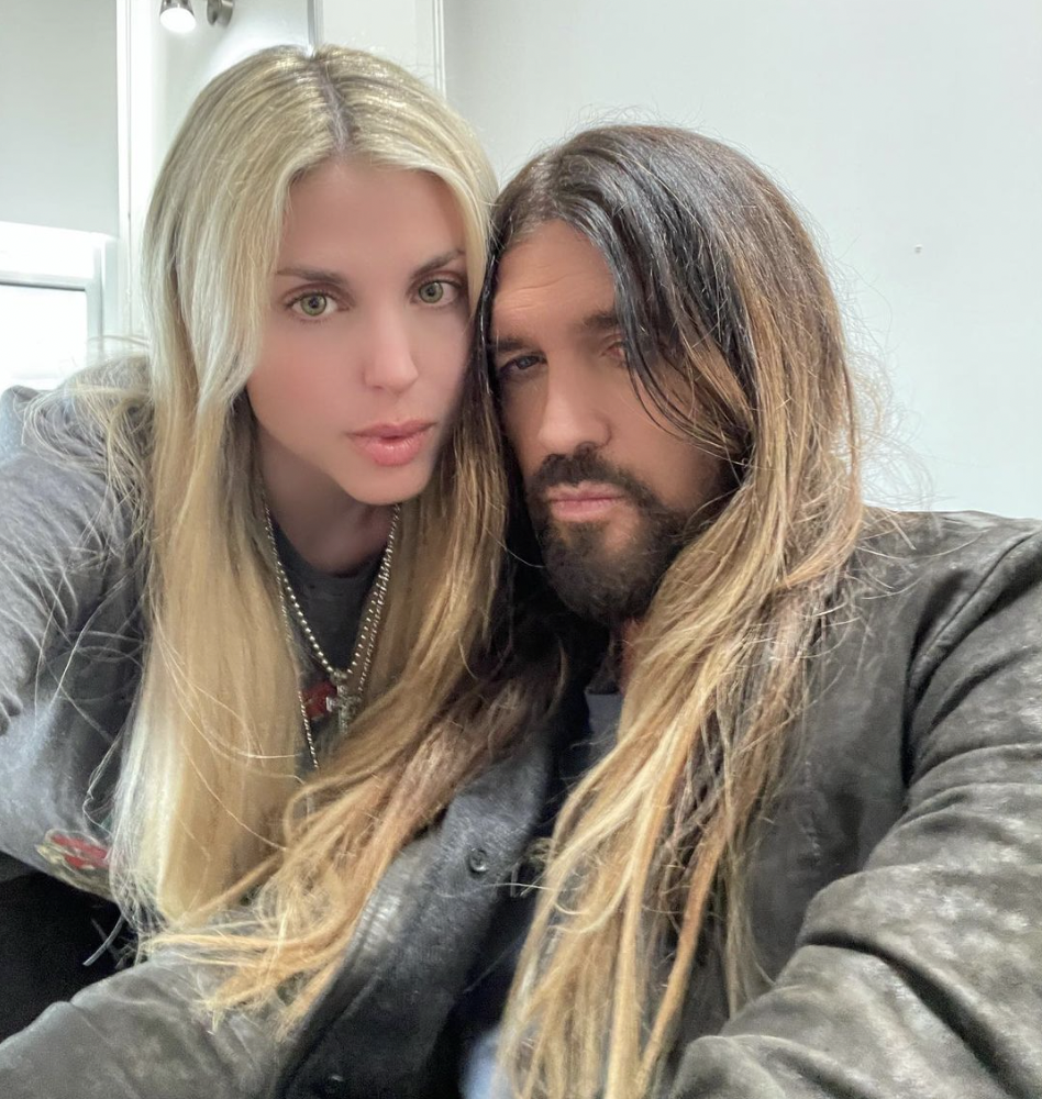 <p>Country music star Billy Ray Cyrus <a href="https://www.wonderwall.com/celebrity/couples/gisele-bundchen-new-boyfriend-celeb-love-news-hollywood-romance-report-november-2022-670465.gallery?photoId=656092">proposed to Firerose</a> in August 2022 following <a href="https://www.wonderwall.com/celebrity/couples/celebrity-breakups-splits-of-2022-famous-couples-divorce-549565.gallery?photoId=584898">his divorce</a> from wife Tish Cyrus, but he actually met the Australian singer-songwriter 12 years earlier. The "Achy Breaky Heart" and "Old Town Road" hitmaker shared the story with <a href="https://people.com/country/billy-ray-cyrus-engaged-firerose-soulmate-happy-pure-love/">People</a> magazine, explaining that he saw his future fiancée -- who's several decades his junior -- for the first time when he took his dog, Tex, outside while working on the Disney Channel series "Hannah Montana" with daughter Miley Cyrus. "There's a couple old pine trees on the [studio] lot that look like Tennessee. Tex and I would go out there in the middle of the day and he'd take care of his business and we'd stretch and I'd think how much I missed Tennessee. On that given day, Firerose came out of the front door. There was almost a moment of, I don't know, recognition. I was like, 'This girl's a star,'" Billy Ray explained. </p><p>Firerose -- who was at the lot for an audition she didn't get and doesn't remember now -- walked over to see his dog and they started chatting. Billy Ray offered to introduce her to some people who worked on "Hannah Montana" and let her watch the cast rehearse, thinking "it might lead to a role or just another contact at Disney. And so, off me and her and Tex went back to the studio and I think she met a lot of the cast and met the producers, writers. And, in some ways, well, in a lot of ways, we became friends." They stayed in touch through the years and during the pandemic became songwriting partners and -- as his marriage to Tish ended for good -- far more.</p>