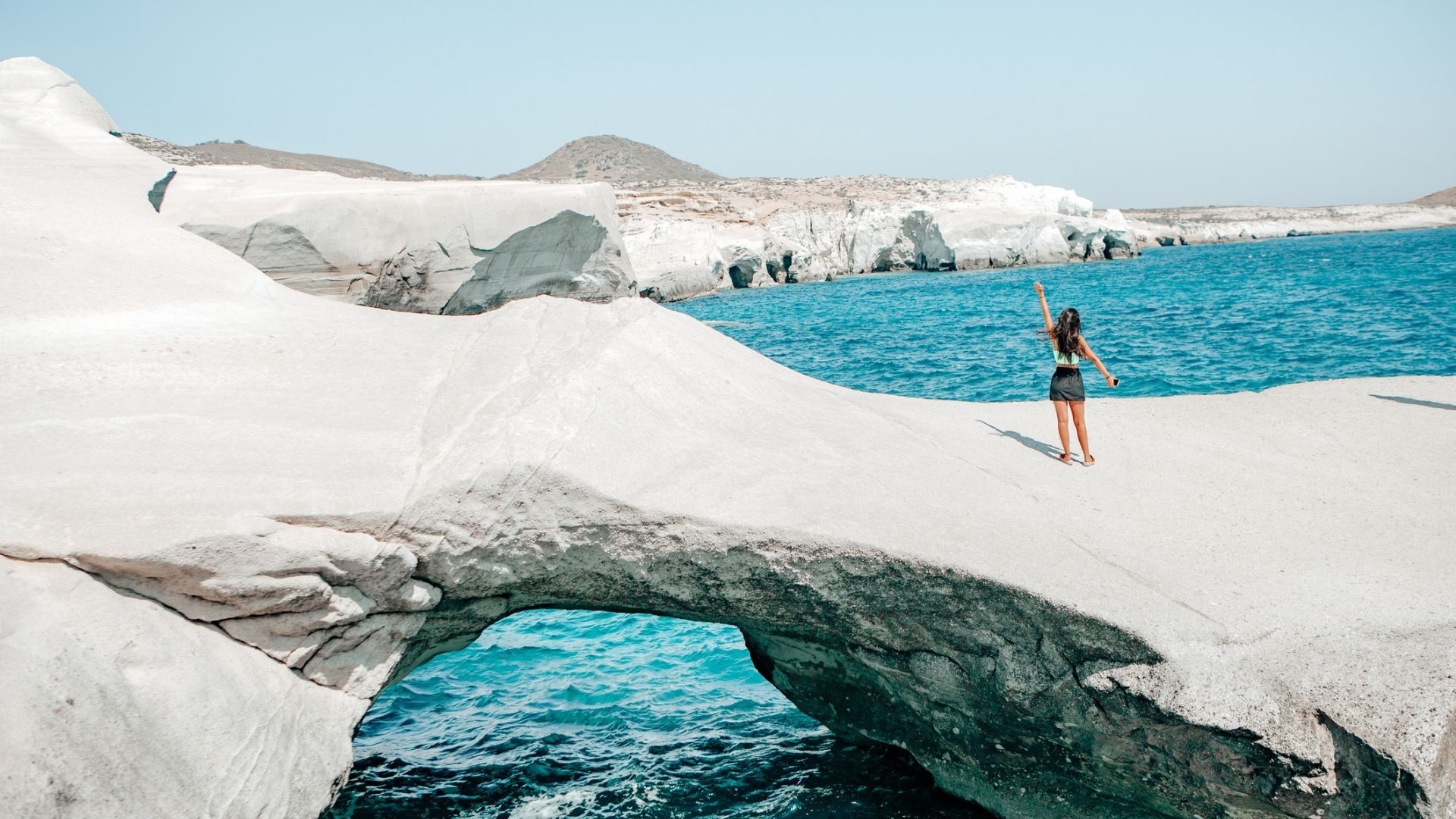 <p>                     Eschew some of the more popular islands and head to Milos for a truly romantic holiday. Accessible via a short flight from Athens or a ferry ride from the popular islands of Santorini, Paros or and Mykonos, this unique island is worth adding to any travel-hopping itinerary.                    </p>                                      <p>                     The volcanic island in the Aegean sea has been growing in popularity over recent years but it still remains unblemished by swelling tourism. Brimming with beautiful beaches and crystal clear waters, it offers everything you’d expect from a Greek Island. But the truly unique thing about Milos is its spell-binding lunar landscapes. Its chalk-white cliffs overlooking the azure-blue ocean feel (quite literally) other-worldly. Sarakiniko Beach boasts white rock formations which have smoothed and shaped over time, giving you the sensation you’re walking on the moon. For a truly unique experience, head to the beach before 8am and immerse yourself in the vast, chalky landscape. Drink in the view of the white-bone moonscapes, then jump into the azure sea below. The beach doesn’t offer much natural shade so if you want to avoid the hottest time of the day, plan to go to the beach for the sunset. We recommend traveling in May or early June. August is hot - and windy, which makes swimming difficult.                    </p>                                      <p>                     There is no public transport operating to the beach, so think about renting a car, scooter, or ATV. The beach is around 10 minutes from Adamas and Plaka so taxis are also reasonable.                   </p>                                      <p>                     <strong>Top tip: </strong>There are no restaurants or bars at Sarakiniko beach, so come ready with water and food. It’s not far from nearby towns but you will have to hop in the car to get there. Be braced: there are also no public toilets.                    </p>