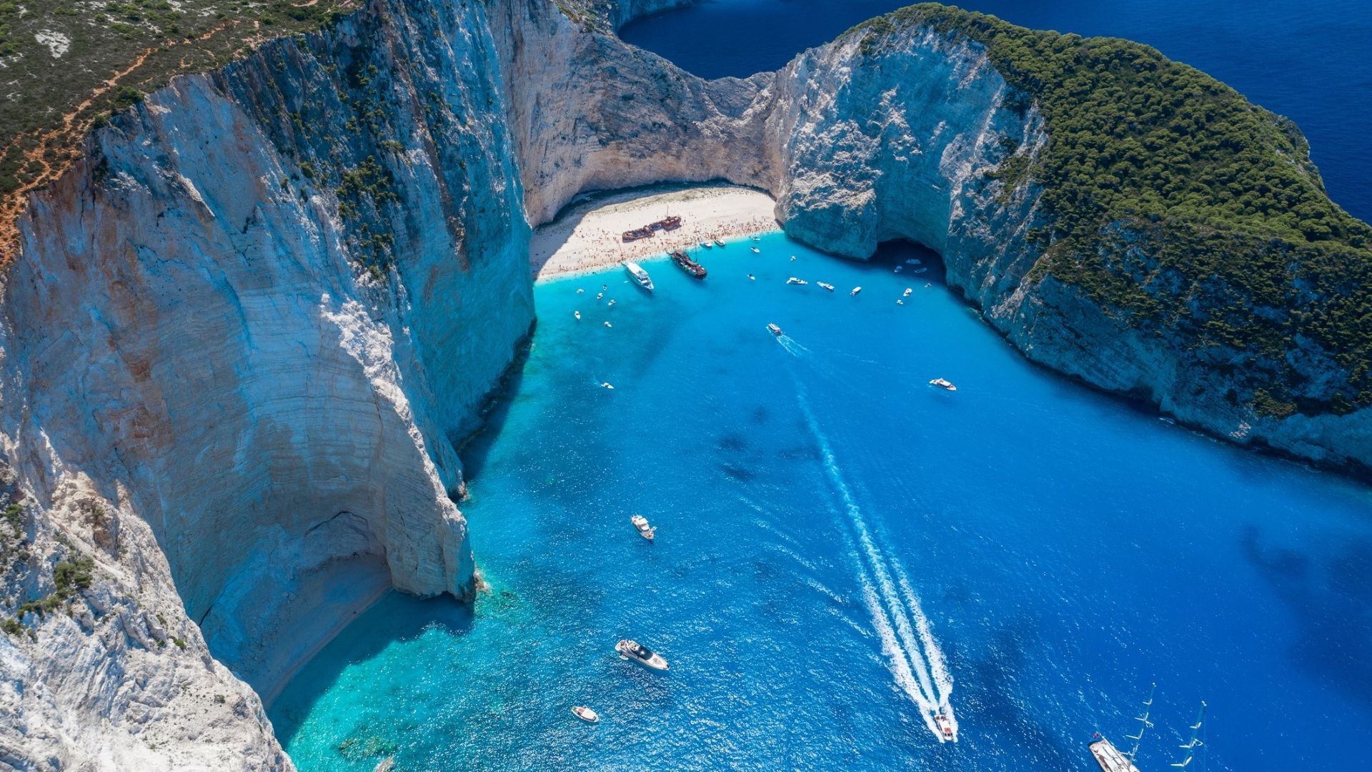 <p>                     Zakynthos island is known for its wild nightlife, but don't be deterred by its party reputation, as the island offers so much more. Its airport is small but extremely well-served, meaning you can often take advantage of holiday deals on offer.                    </p>                                      <p>                     Once again, renting a car is advisable to really scale the island and experience its breathtaking views in their full glory. But if you can't, consider staying in Zante Town - the island's capital, where the central bus station is located. Full of picturesque Venetian-style houses and buildings, the town is the cultural hub of the island. But to really immerse yourself in the island culture, head to Vasilikos, the village and community which is located around 15 kilometers south of the town. This part of the island is decidedly sleepy, making it one of the best European vacations for families but solo travelers or couples would enjoy it just as much. While away the day on Gerakas Beach, a long, golden beach on the southern tip of the peninsula, home to the famous Loggerhead Turtles who nest in protected areas of the beaches. Banana beach, the biggest beach on the island is also located nearby. A long, wide beach with sparkling and shallow waters, you can also take part in an array of watersports here.                    </p>                                      <p>                     If you have a car, take a 15-minute ride to Porto Mela, a taverna perched on Dafni beach that serves up all the favorites plus a selection of fresh seafood. If you're feeling adventurous, try rabbit in red sauce (kouneli stifado) - one of the island's signature dishes. Like most Greek cuisine, it's delicious, messy, and entirely unpretentious. Most restaurants will have different stifado options with other meats on offer too. Wash it down with a carafe of local wine - the island is home to many large vineyards and it's common for families to produce their own.                   </p>                                      <p>                     <strong>Top tip: </strong>While the south is rich with nature, beaches, and cuisine, don't leave Zante before visiting the north end of the island where the famous Navagia beach is located. Otherwise known as shipwreck beach, the remains of the MV Panagiotis ship have been planted on the white sand since the ship sunk in 1982. It's accessible only by boat, but avoid booking a boat to specifically go there - instead find an itinerary that includes Navagia beach as part of an island tour. In most cases, you'll pay the same price but see multiple destinations.                    </p>