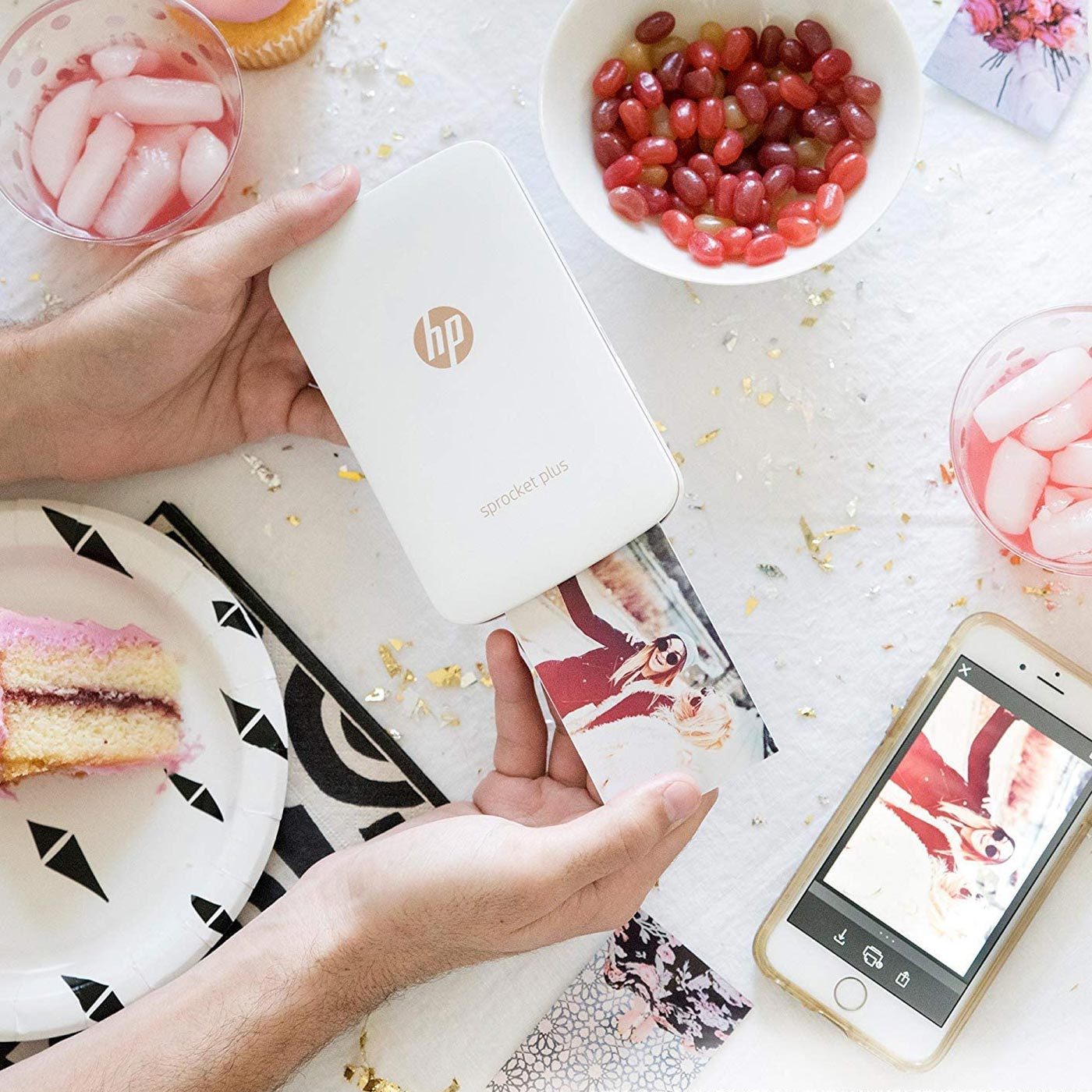<p class="p1">Smartphone photography makes capturing memories easier than ever, and this <a href="https://www.amazon.com/HP-Sprocket-Instant-Printer-Sticky-Backed/dp/B076SHP2S6/" rel="noopener"><span>HP Sprocket portable printer</span></a> makes it convenient to print pictures during one's travels. The traveler in your life can use this gift to have instant prints of their adventures in real time to share with fellow travelers or put in their journals. We love that this printer is thin and lightweight, so it's not a burden to carry in a purse or backpack.</p> <p class="listicle-page__cta-button-shop"><a class="shop-btn" href="https://www.amazon.com/HP-Sprocket-Instant-Printer-Sticky-Backed/dp/B076SHP2S6/">Shop Now</a></p>