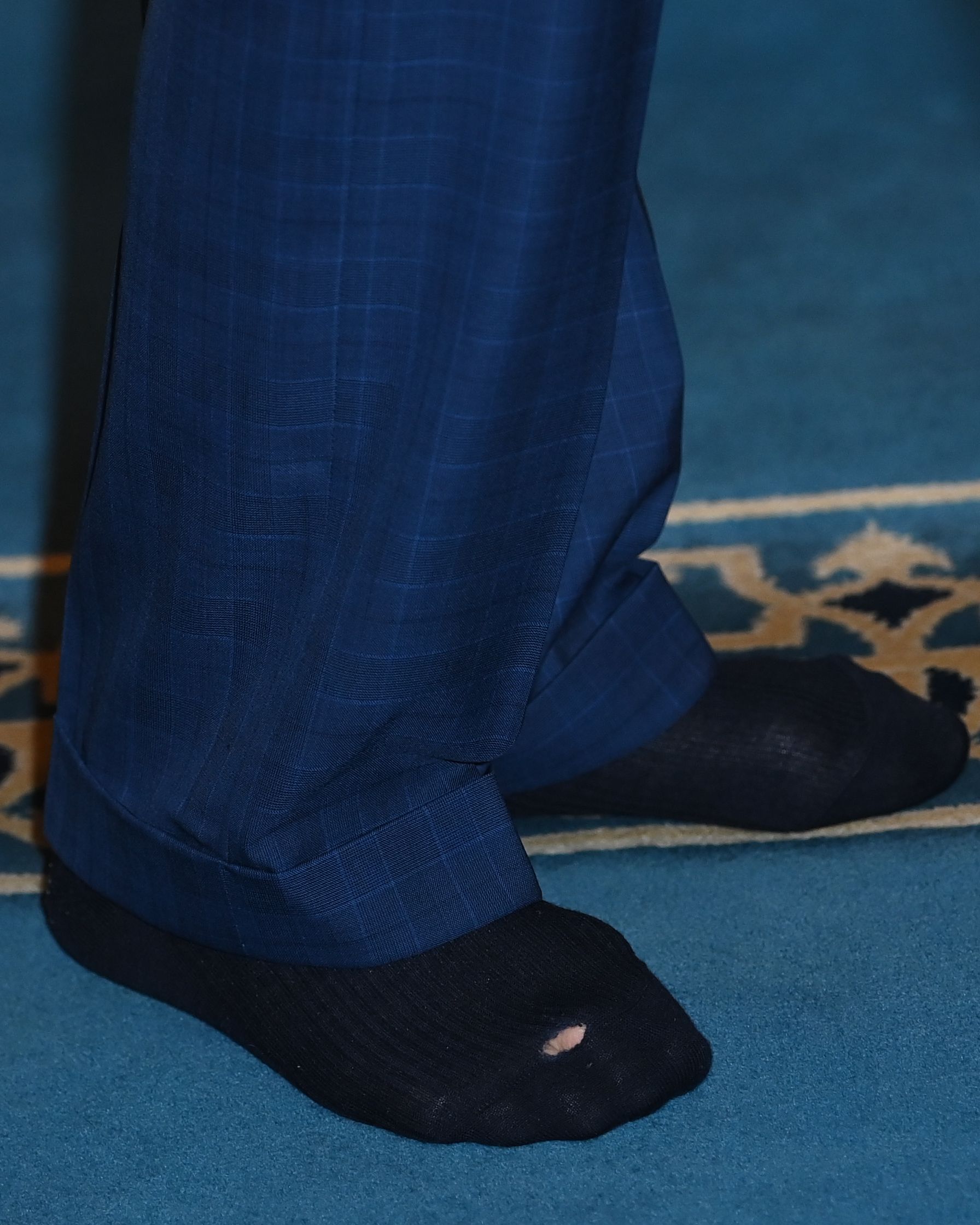 <p>King Charles III revealed a hole in his royal sock when he took off his shoes during a visit to the Brick Lane Mosque in London on Feb. 8, 2023.</p>