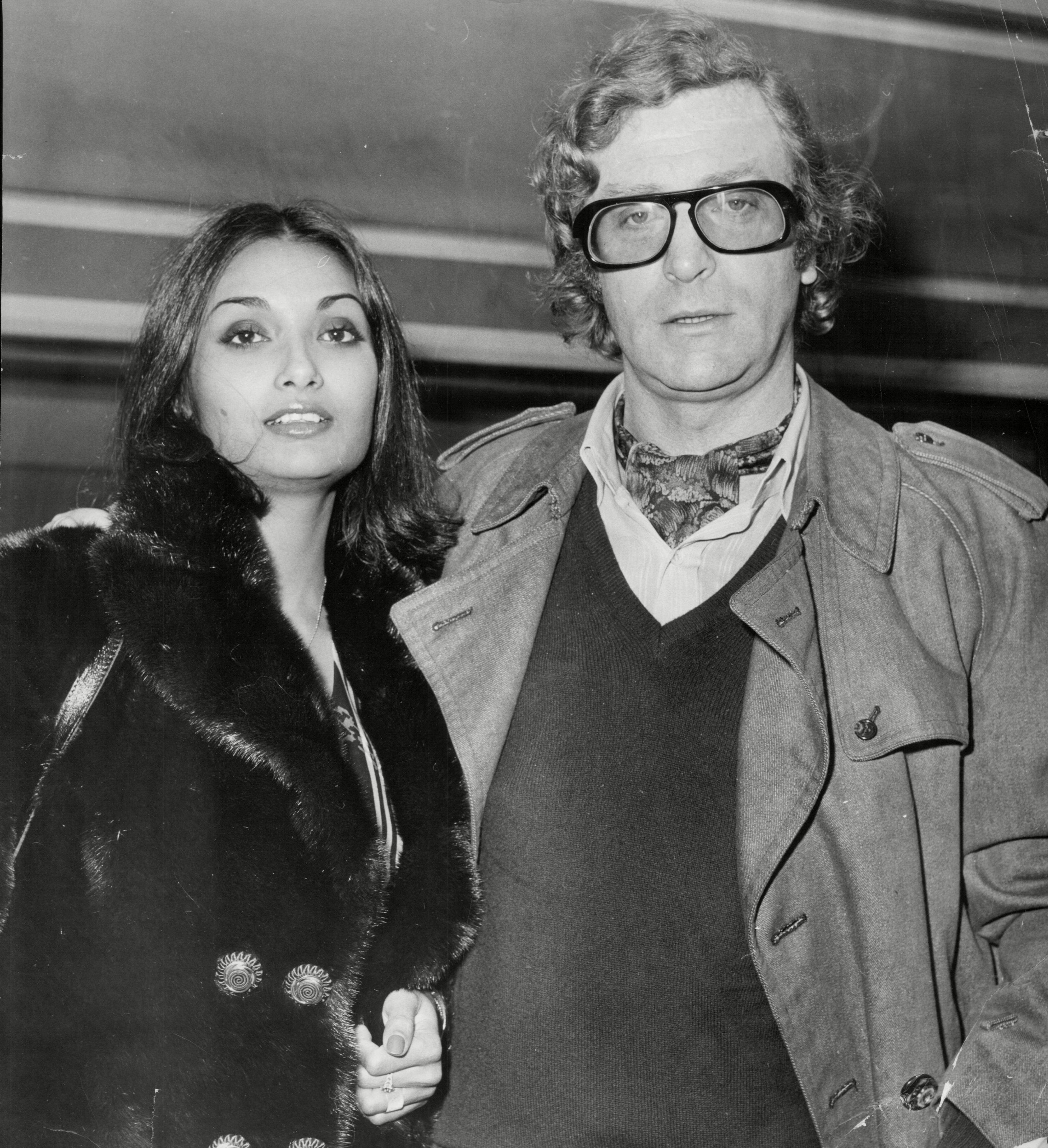 <p>Michael Caine and Shakira Baksh have been happily married since 1973. Their epic love story started one night in 1971 when the English acting legend was watching TV at home with a buddy. A Maxwell House coffee advertisement set in Brazil came on -- and Shakira, a model, was in it. "I saw this lady on the television in a commercial and fell in love instantly," Michael confessed on "The Jonathan Ross Show" in 2018. "I thought, 'That's the woman for me,' and I said to my mate, 'We're going to Brazil in the morning. We're going to find her.'" </p><p>The same night, they went to their local disco (it was the '70s, after all) where a mutual friend who worked in advertising joined them. When Michael mentioned the woman and his travel plans, the guy blew Michael's mind: "We make that commercial," he told the actor, who also shared the story on Andrew Denton's "Interview" show in Australia in 2019. The guy then informed Michael that Shakira wasn't Brazilian but of Indian descent (she was born in British Guiana) and told him, "She's not in Brazil, she's in Fulham Road," which was barely a mile from Michael's place. </p><p>He got Shakira's number and "I phoned her 11 times, 10 of which she wouldn't go out with me," he said. "The last one she decided to go out with me... We went out and fell in love instantly and have never parted since."</p>