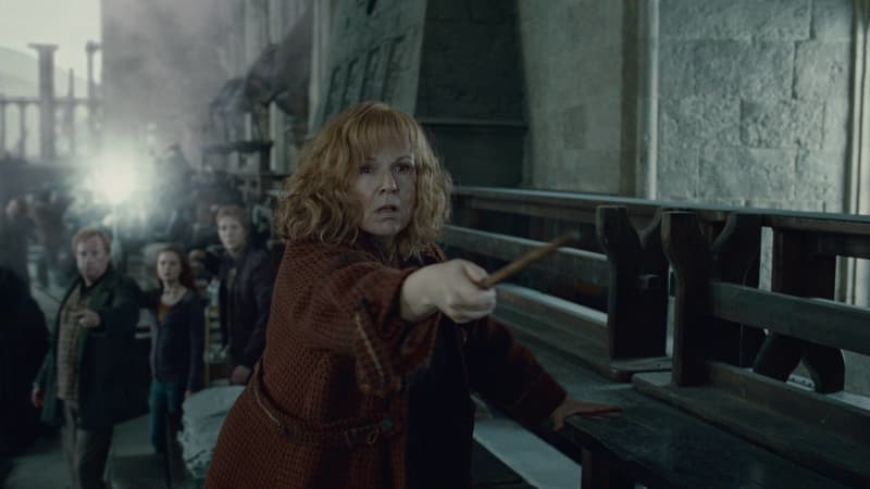 <p>"Molly Weasley" is the protective and caring mother of "Ron" and his many siblings, including "Ginny"! In the Harry Potter films, she was portrayed by legendary British actress Julie Walters.</p>