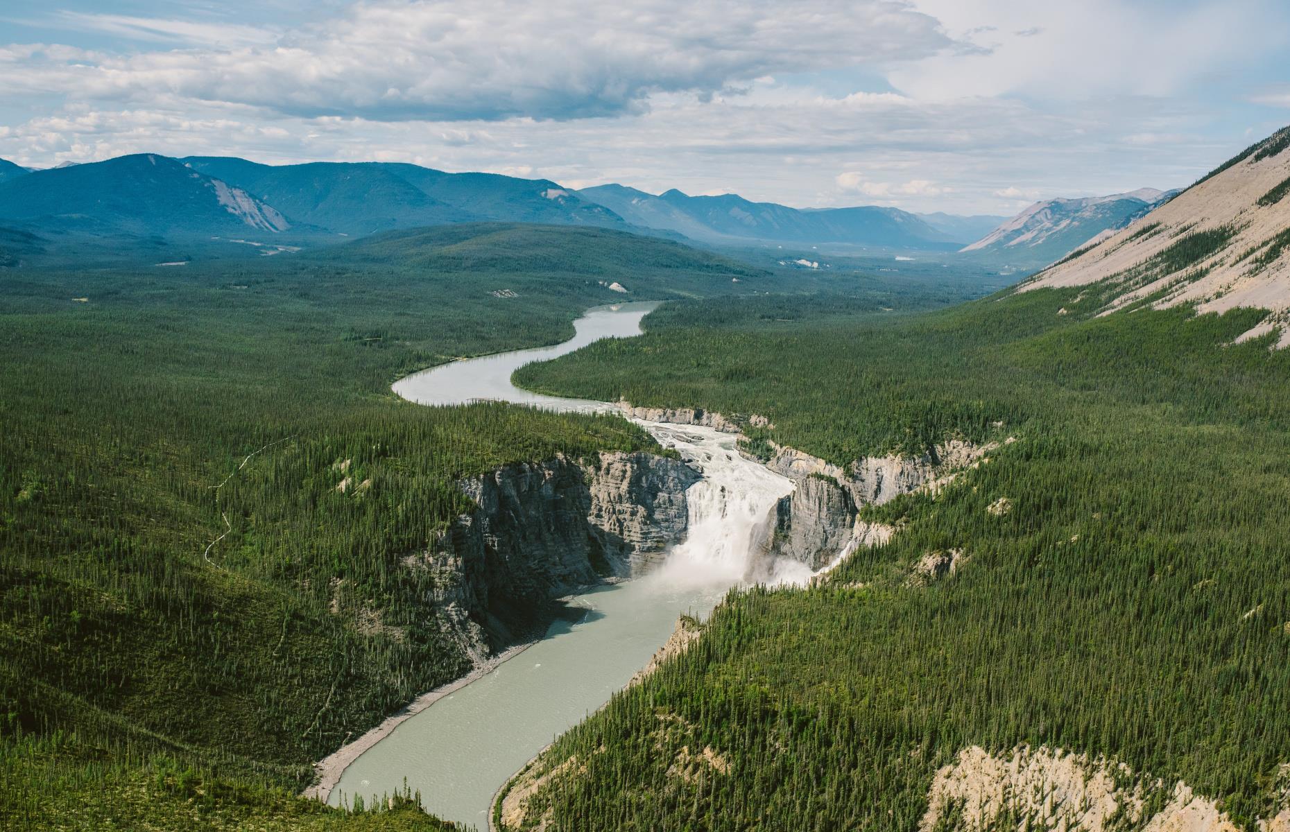 <p><a href="http://parks.canada.ca/pn-np/nt/nahanni">Nahanni National Park Reserve</a> sits on the South Nahanni River alongside Nááts'įhch'oh, its sister park reserve. Even though the parks sit side-by-side, they each have their own flavor. Nahanni’s greatest claim to fame beyond the river itself is the Cirque of the Unclimbables, a collection of granite spires, as well as Náįlįcho (Virginia Falls), a gorgeous waterfall that's twice as high as the famed Niagara Falls.</p>  <p><a href="https://www.loveexploring.com/galleries/146408/canadas-most-famous-attractions-and-their-secrets?page=1"><strong>Canada's most famous attractions and their secrets</strong></a></p>