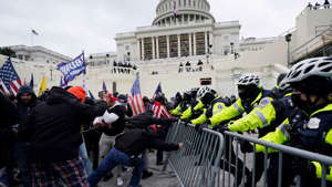 Protesters try to break through a police barrier, Jan. 6, 2021, at the Capitol in Washington. (AP Photo/Julio Cortez, File) AP Photo/Julio Cortez, File