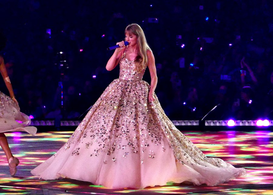 <p>Swift glittered in a gold gown while singing “Enchanted” to the Glendale concertgoers.</p>