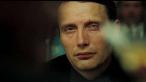 Le Chiffre (Mads Mikkelsen) takes measures to try and get Bond (Daniel Craig) out of the card game in CASINO ROYALE (2006). To make the poker game look realistic the cast were given lessons in how to play Texas Hold ‘Em which included the correct way to hold and protect your cards. They would also play for two or three hours after filming had finished, sometimes with real money. “I’m sure there was a lot of money lost on that set,” said Daniel Craig.