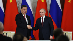 Russian President Vladimir Putin and Chinese President Xi Jinping shake hands in Moscow, Russia, on Tuesday, March 21. The Kremlin Wednesday said the West's reaction to Xi's visit has been "hostile." Mikhail Tereshchenko/Sputnik/Kremlin Pool Photo