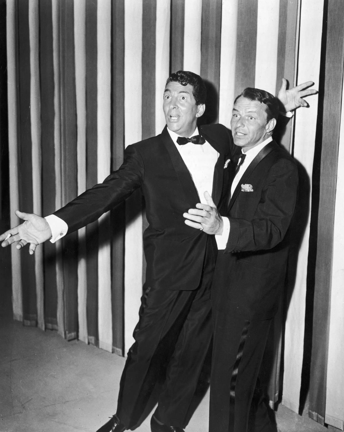 <p>Two members of the legendary Rat Pack, Dean Martin and Frank Sinatra, are seen goofing off on the variety television program <i>The Dean Martin Show</i>.</p> <p>While they were both singers, their love of entertainment brought them in front of the camera and all the small and silver screen numerous times throughout their respective careers.</p>