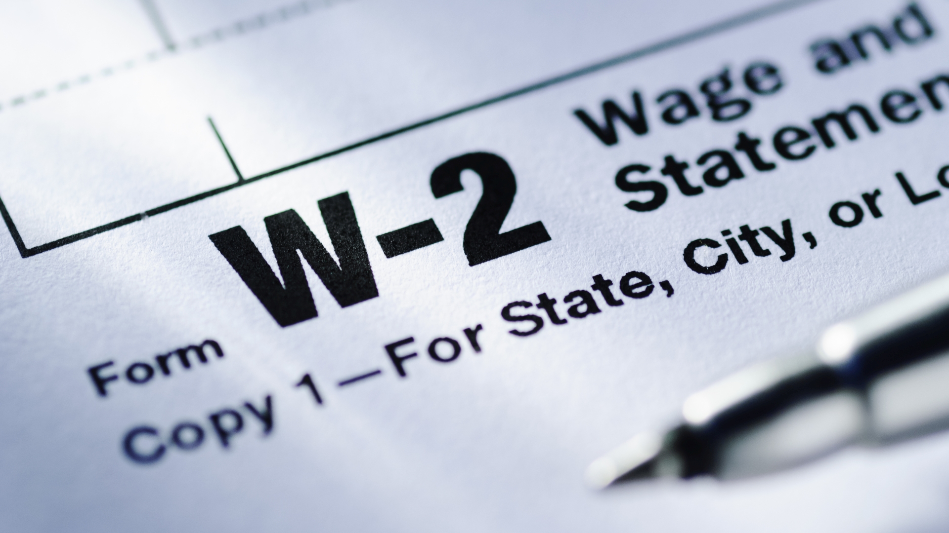 Pen on a Form W-2 Wage and Tax Statement