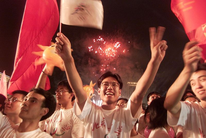 ▲2008年北京奧運，主題口號為「同一個世界，同一個夢想」，當時最常聽到的口號就是「北京歡迎你」。資料照。（圖／美聯社／達志影像）