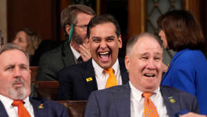 Rep. George Santos, seen laughing ahead of a Biden's State of the Union address last month, is now facing a formal House Ethics investigation. Jacquelyn Martin/AP/Bloomberg via Getty Images