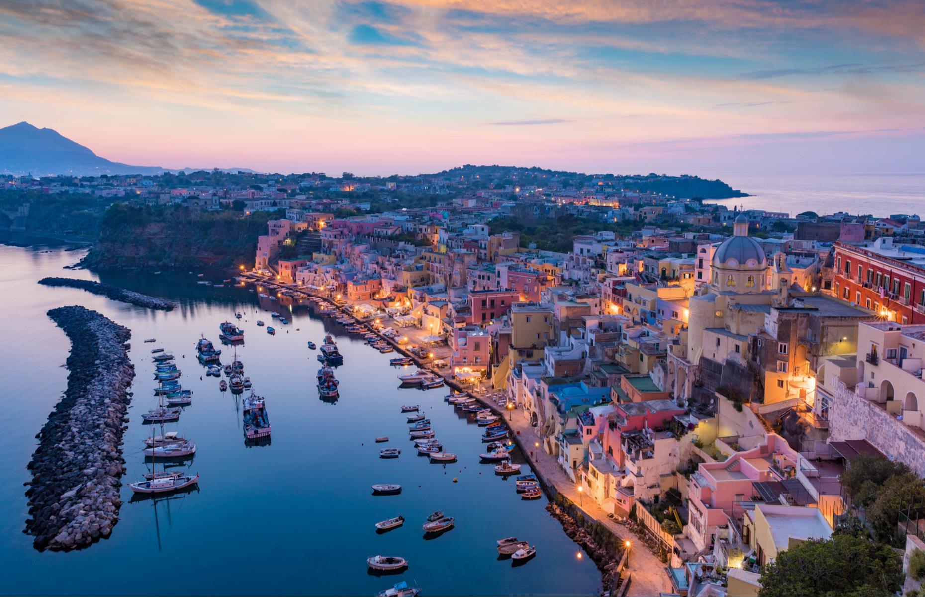 <p>A quaint spot nestled in a bay on the small island of Procida, off the west coast of Naples, Marina Corricella is recognisable for its adorable multicoloured houses. The 17th-century port is best-known for its stunning architecture and it’s not hard to see why, with decorative domes, arches, terraces, windows and balconies creating a colourful view from above. These are <a href="https://www.loveexploring.com/galleries/76327/the-most-beautiful-small-towns-in-the-world">the world's most beautiful small towns</a>.</p>