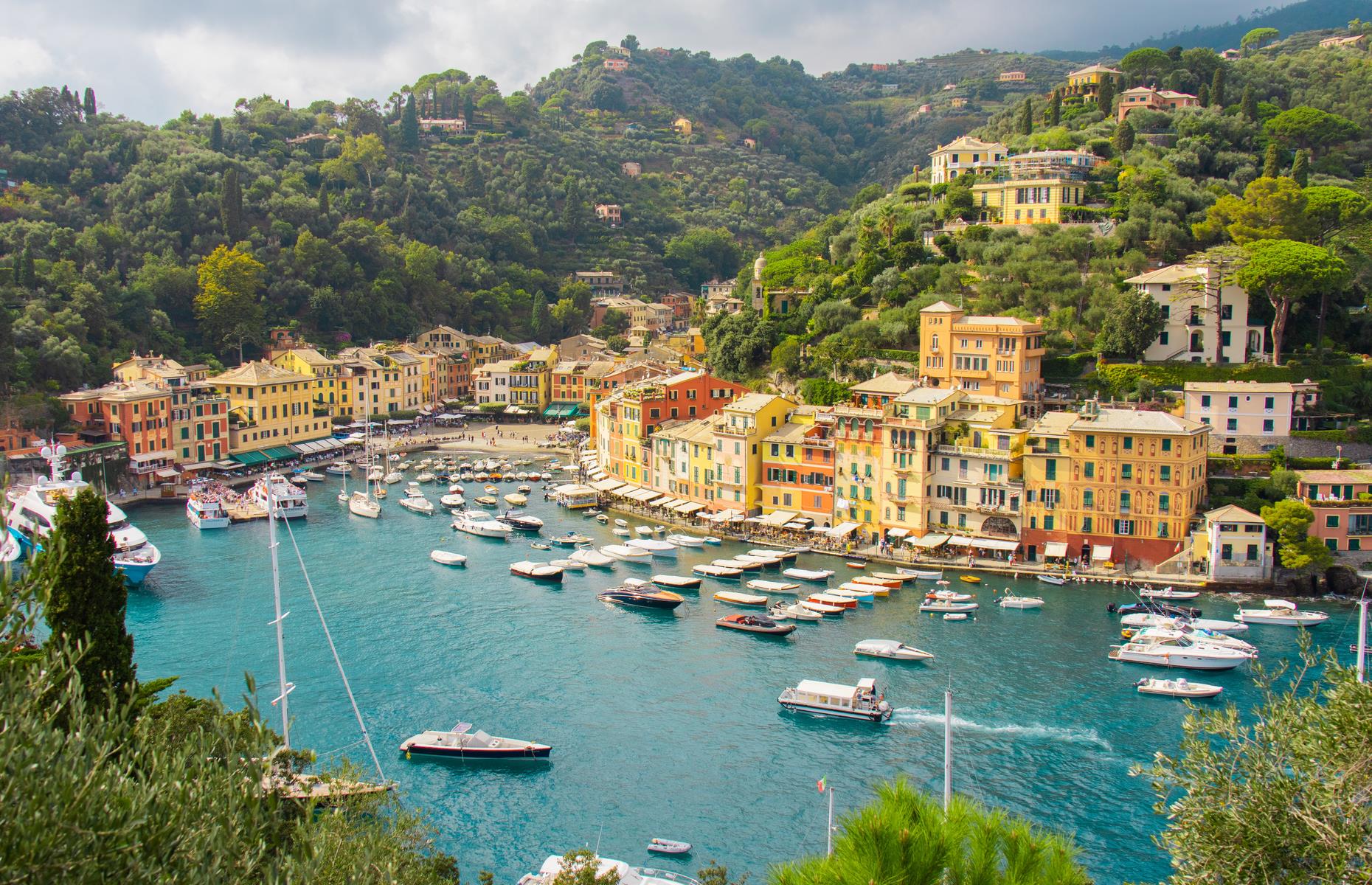 <p>A former fishing village turned fashionable port town, Portofino draws in visitors with its pretty pastel-coloured houses and honeysuckle-clad hills overlooking a dazzling harbour. Situated on its own peninsula on the northeast coast of Italy, it’s the perfect spot for panoramic views over the Italian Riviera. These are <a href="https://www.loveexploring.com/news/94624/stunning-images-of-europes-most-adorable-small-towns-and-villages">Europe's most charming towns and villages</a>.</p>