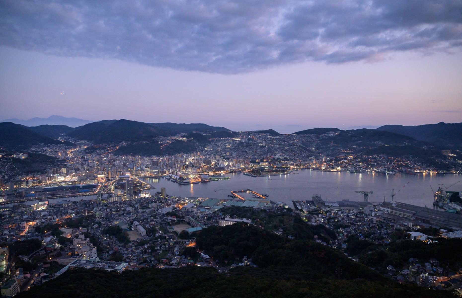<p>With its glimmering lights and mountainous backdrop, it’s no surprise that the pretty Nagasaki Port is Japan’s second-biggest cruise destination. Lying at the head of a long bay, liners usually dock at Matsugae Wharf, which is within easy reach of a streetcar stop for exploring the city. Now take a look at <a href="https://www.loveexploring.com/galleries/96347/the-worlds-empty-and-beautiful-beaches-from-above">the world's beautiful beaches from above</a>.</p>