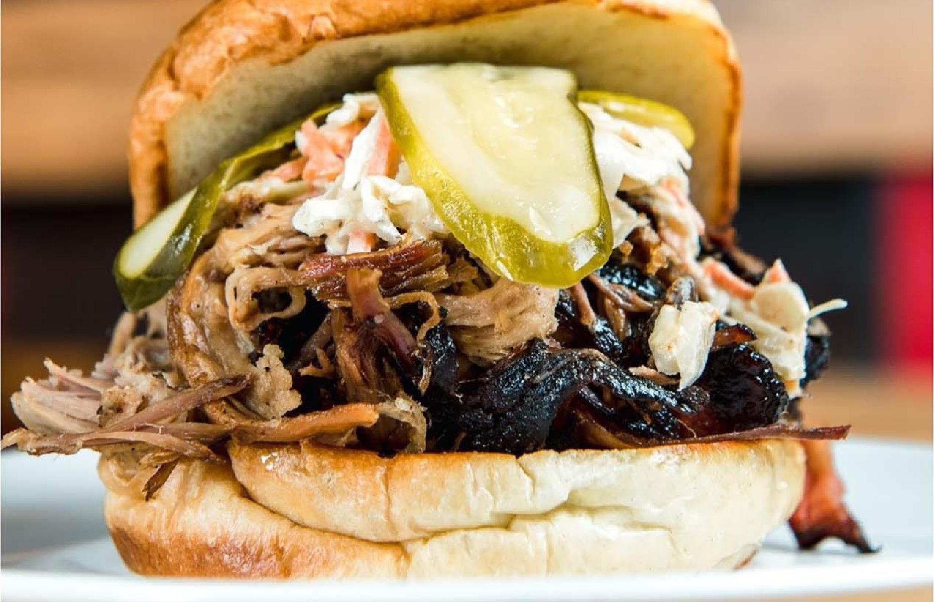 <p>The choice at <a href="https://slowsbarbq.com/">this casual BBQ joint</a> in Detroit is simple. First, pick your meat – pulled pork, beef brisket, or BBQ chicken – then add a side like waffle fries, pit-smoked beans, or mac 'n' cheese, and finish with a hot fudge brownie or carrot cake. There's also an enticing specials menu with bacon fried rice and cheese fries, as well as a <a href="https://www.yelp.com/biz/slows-bar-bq-detroit">good selection of burgers</a> – try the signature Reason burger with smoked pulled pork, coleslaw, and dill pickles.</p>