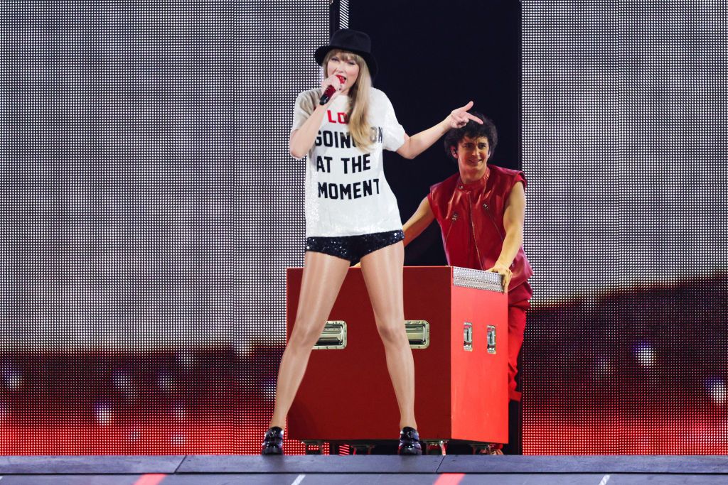 <p>Bringing back nostalgia for her “22” music video, Swift wore a shirt that red “Not A Lot Going On At The Moment” and a black Gladys Tamez hat. On the second night of the tour, she changed the t-shirt text to read, “Who's Taylor Swift Anyway? Ew.”</p>