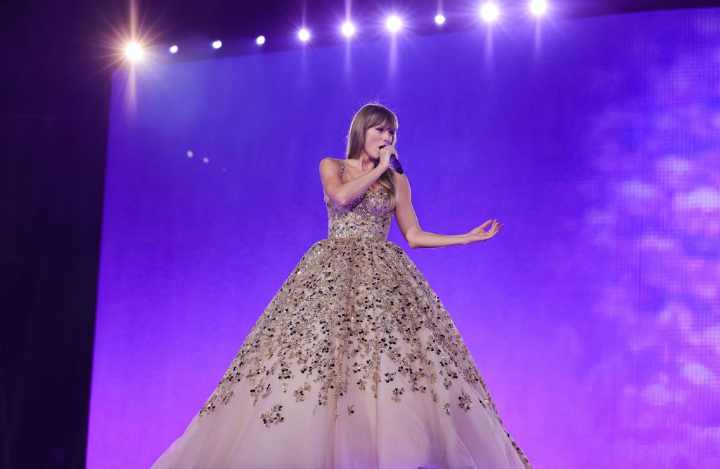 <p>While singing “Enchanted,” Swift wore another sparkling ensemble, a ball-gown from <a href="https://www.instagram.com/p/Cp9dCCCPPct">Nicole + Felicia Couture</a>. The wide skits was covered in flowery appliqués.</p>