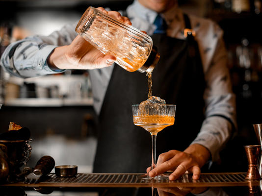 There are many ways customers can waste money on drinks, according to bartending experts. Maksym Fesenko / Shutterstock