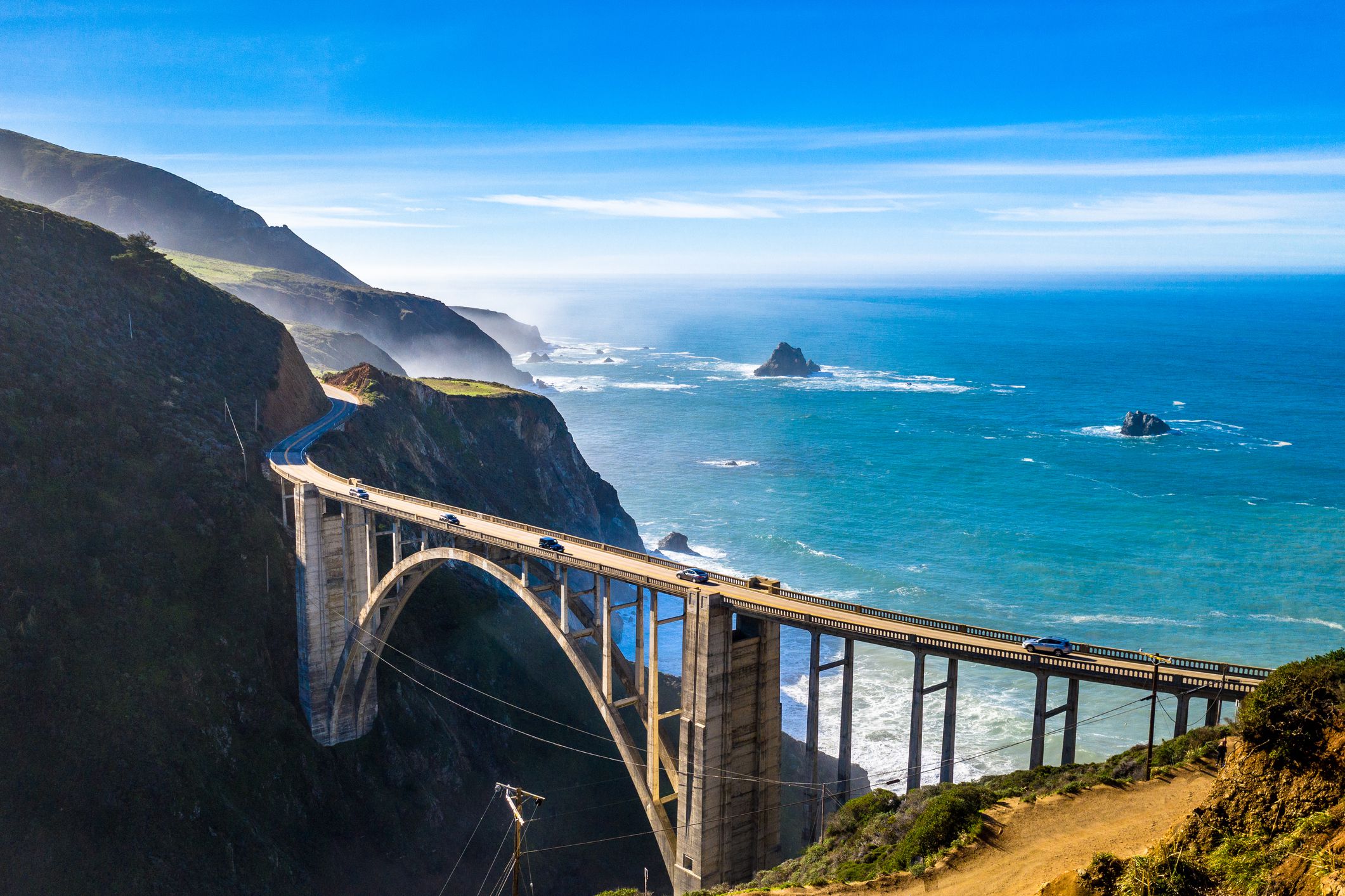 <p><b>California, Oregon, and Washington</b>Jaw-dropping views of the Pacific, sandy beaches, redwood forests, and interesting towns make this a route to tackle not in days, but weeks — especially when you combine the <a href="https://www.visittheusa.com/trip/pacific-coast-highway-road-trip">Pacific Coast Highway</a> with the Pacific Coast Scenic Byway in Oregon and Washington. Mealer recommends the stretch from San Francisco north through those two states. "You must take time to see the lighthouses and some of the little towns along with the historic spots," she raves. "It took me over two weeks to make that ride." Though not as technical as some of the other roads on our list, the road can be twisty as it hugs the coast, and the steep drop off to the water can churn the stomach of even experienced riders.</p>  <p><b>Can't-miss stop:</b> How to pick just one? History buffs will want to carve out an afternoon to explore <a href="https://hearstcastle.org/">Hearst Castle</a>, William Randolph Hearst's epic estate, near San Simeon, California. Further north, in Big Sur, the Bixby Bridge is the star of one of the most-photographed vistas on the coast. </p>