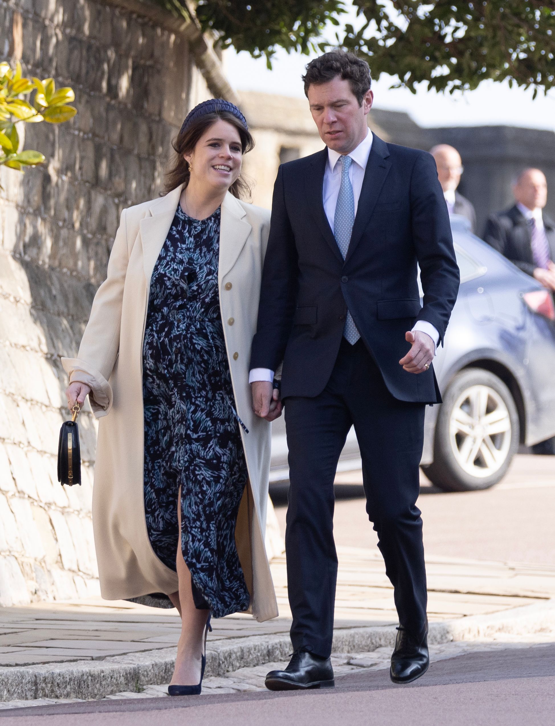 <p>Princess Eugenie -- who's pregnant with her second child -- held hands with her husband, Jack Brooksbank, on their way to the Easter Mattins Service at St. George's Chapel at Windsor Castle in England on April 9, 2023.</p>