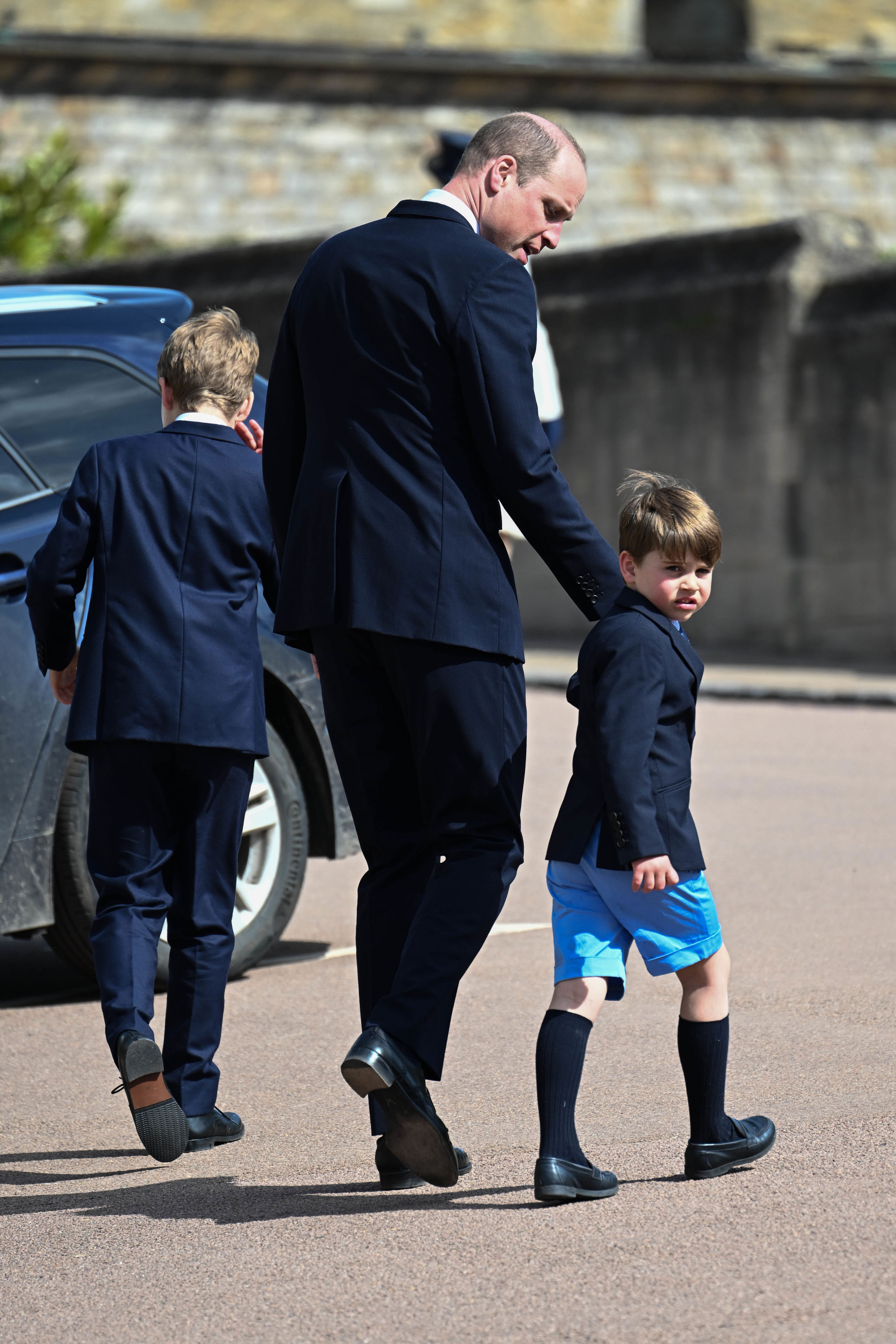 <p>Prince Louis glared at the camera while walking with his big brother, Prince George, and their father, <a href="https://www.wonderwall.com/celebrity/profiles/overview/prince-william-482.article">Prince William</a>, following the Easter Mattins Service at St. George's Chapel at Windsor Castle in England on April 9, 2023.</p>