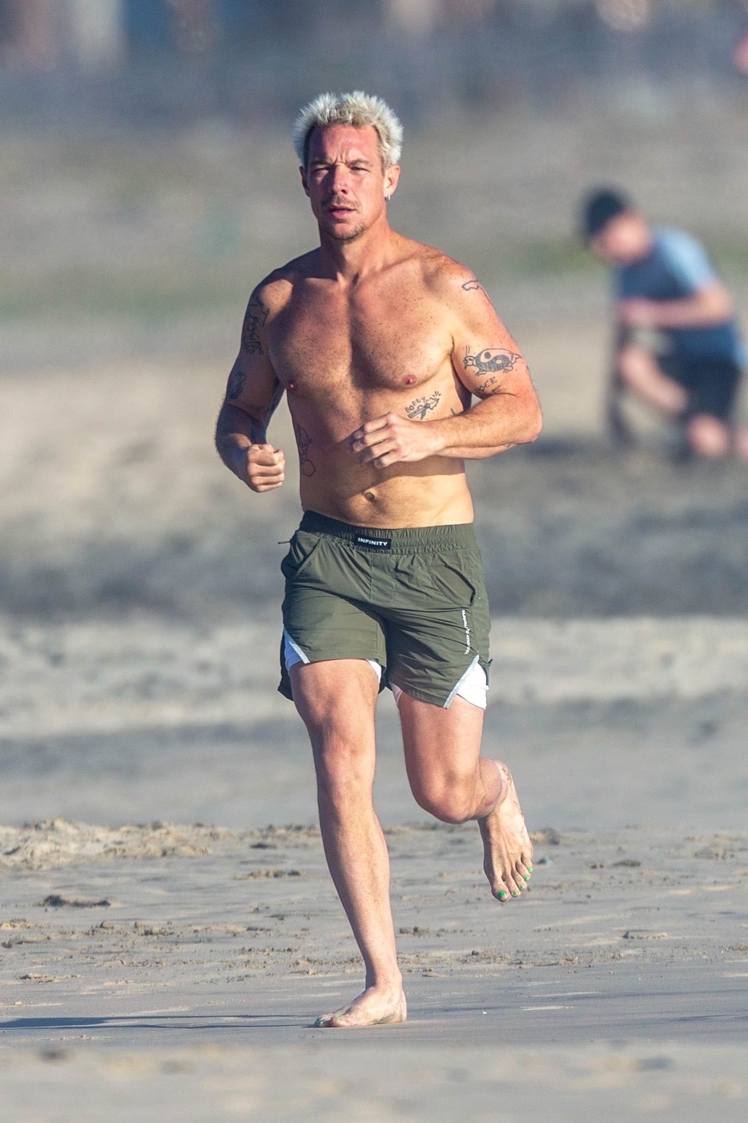 <p>On March 15 -- one day after he shared some candid revelations about his sexuality on Emily Ratajkowski's podcast -- DJ and producer Diplo went for a run on the beach in Cabo San Lucas, Mexico.</p>