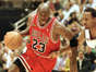 Michael Jordan of the Chicago Bulls goes to the basket past Shandon Anderson of the Utah Jazz 14 June during Game six of the NBA Finals at the Delta Center in Salt Lake City, UT.