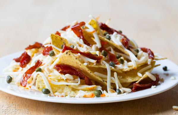 If you think about it, nachos are kind of like a different type of salad. This one features cheese, capers, sun-dried tomatoes, and pine nuts for a totally easy but totally delicious. This is also a great way to get rid of leftovers if you have extra veggies in the fridge! (via <strong><a href="https://www.aspicyperspective.com/nachos/">A Spicy Perspective</a></strong>)