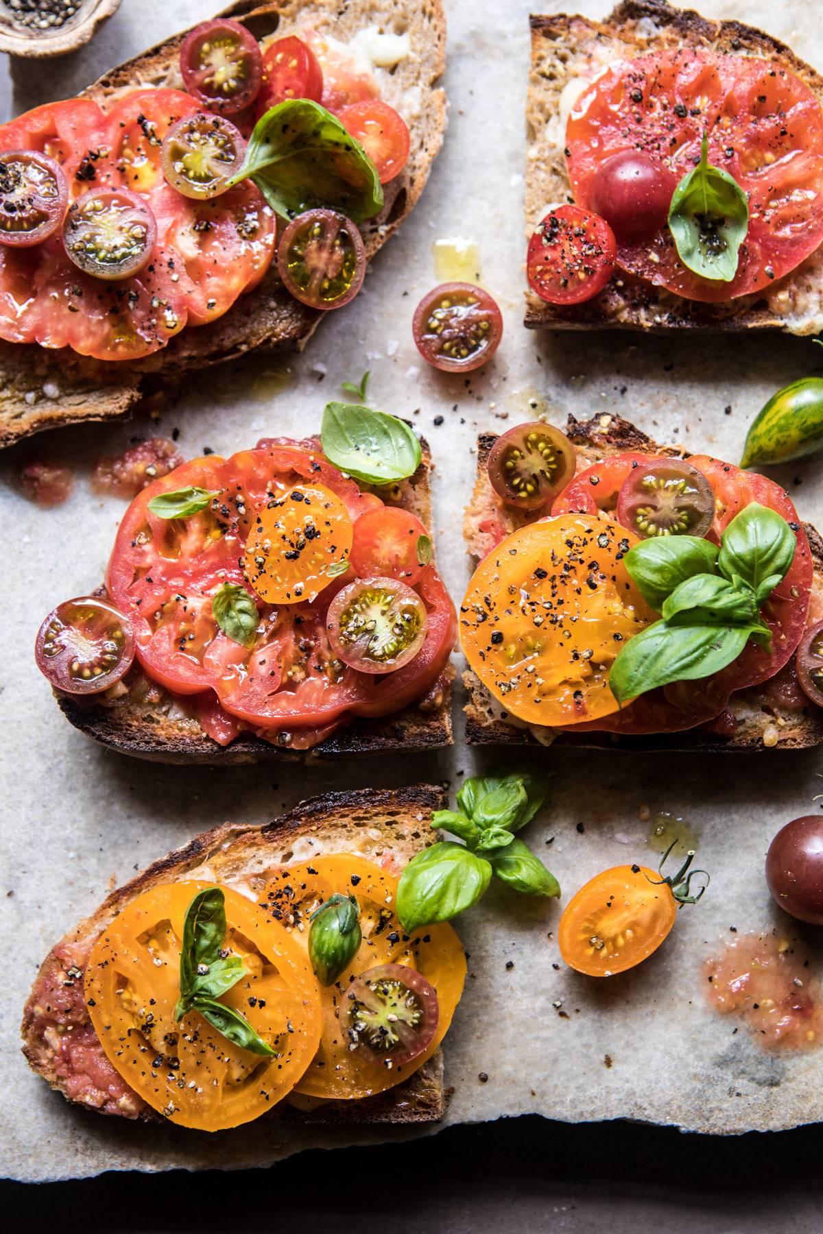 While your bread is toasting, slice up a tomato and some manchego, layer them on the bread, and finish with a drizzle of olive oil and a sprinkle of basil, salt, and pepper. (via <a href="https://www.halfbakedharvest.com/heirloom-tomato-basil-and-manchego-toast/"><strong>Half Baked Harvest</strong></a>)