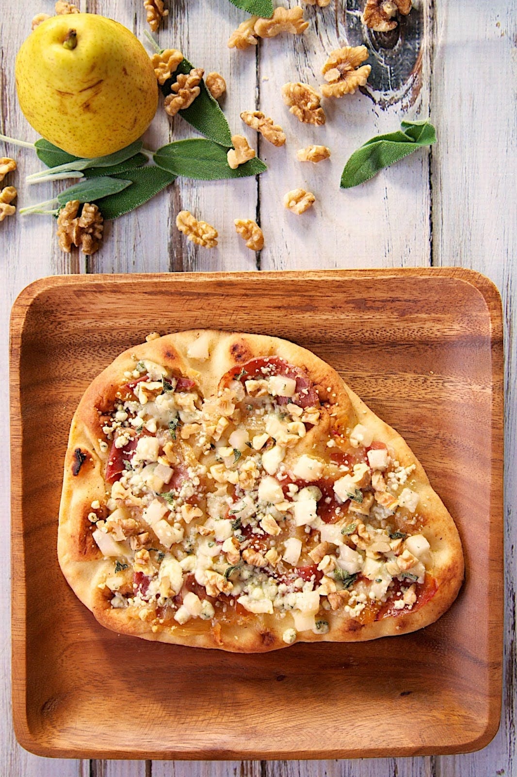 The combination of sweet <a href="https://www.brit.co/pear-recipes/"><strong>pears</strong></a> with salty blue cheese and prosciutto (on a piece of naan) makes this a toaster-oven lunch you’ll crave even after you’re done eating it. (via <strong><a href="https://www.plainchicken.com/2015/05/pear-gorgonzola-flatbread.html">Plain Chicken</a></strong>)