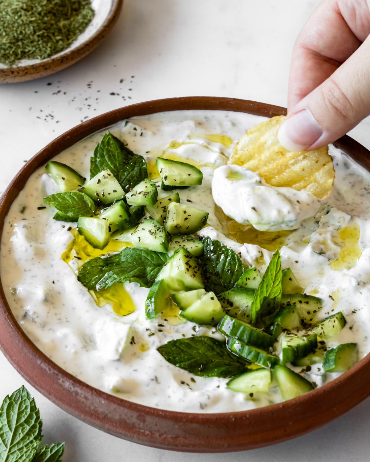 Enjoy this fresh-tasting dip with a bag of chips or toast for a satisfying lunch. (via <a href="https://forksandfoliage.com/cucumber-mint-yogurt-salad-cacik/"><strong>Forks & Foliage</strong></a>)