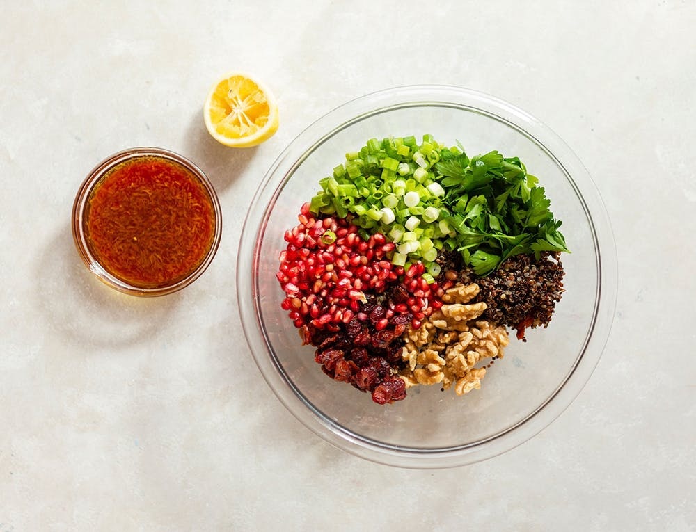 If you have leftover quinoa, add in all your fave fruits (dried or fresh), nuts, and herbs for a psuedograin salad that will satiate. Whether you eat it cold or warm, this is a lunch that won't leave you wanting more. (via <strong><a href="https://www.brit.co/fall-quinoa-salad/">Brit + Co.</a></strong>)