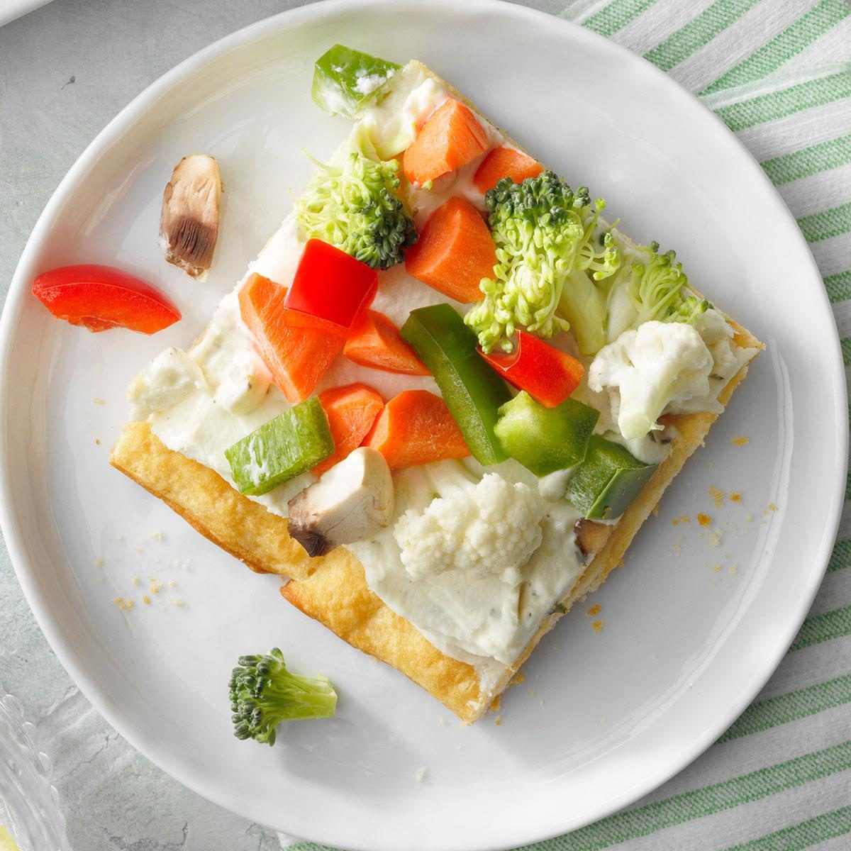 <p>Don't sweat it when it comes to tailgate food. Just carry in this colorful veggie pizza that's topped with a rainbow of crunchy vegetables! —Brooke Wiley, Halifax, Virginia</p> <div class="listicle-page__buttons"> <div class="listicle-page__cta-button"><a href='https://www.tasteofhome.com/recipes/fresh-veggie-pizza/'>Go to Recipe</a></div> </div>