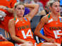 Haley Cavinder #14 of the Miami Hurricanes and Hanna Cavinder #15 of the Miami Hurricanes sit on the bench during the second half against the Villanova Wildcats in the Sweet 16 round of the NCAA Women's Basketball Tournament at Bon Secours Wellness Arena on March 24, 2023 in Greenville, South Carolina.