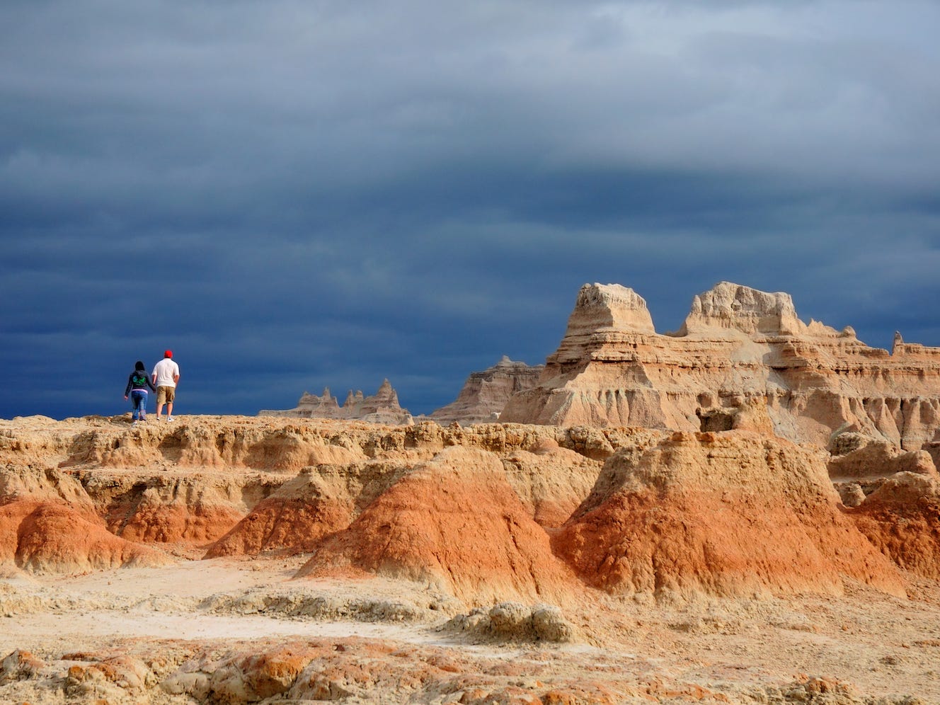 <p>The Badlands' otherworldly rock formations and fossil beds stretch for <a href="https://www.nps.gov/badl/index.htm">244,000 acres.</a></p>