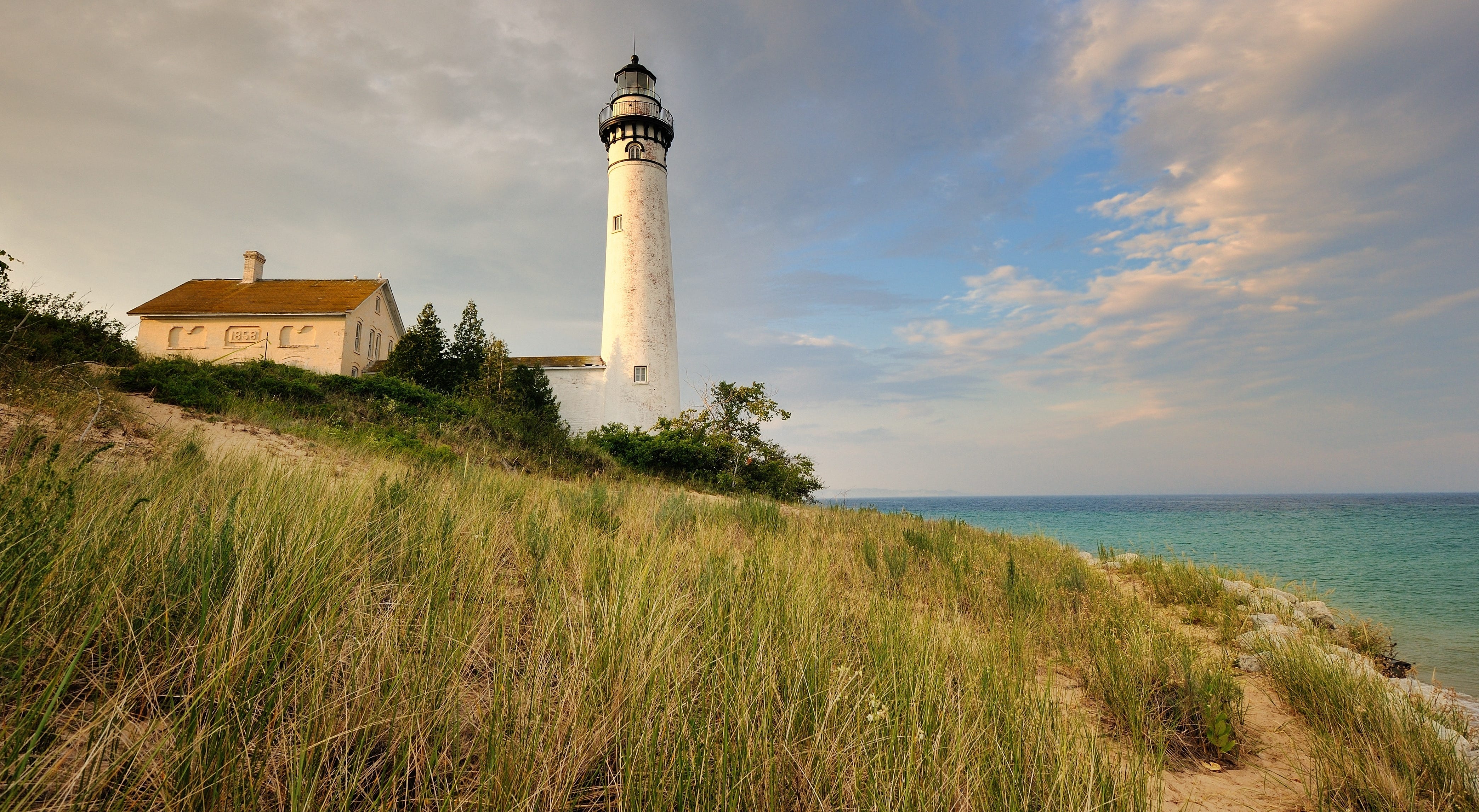 <p>Located on the <a href="https://abcnews.go.com/Travel/best_places_USA/sleeping-bear-dunes-michigan-voted-good-morning-americas/story?id=14319616">coast of Lake Michigan</a>, the park features 64 miles of beaches as well as rolling sand dunes, inland lakes, hiking trails, and water sports.</p>