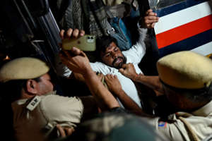 Police personnel detain activists and supporters of India's Congress party (AFP/Getty)