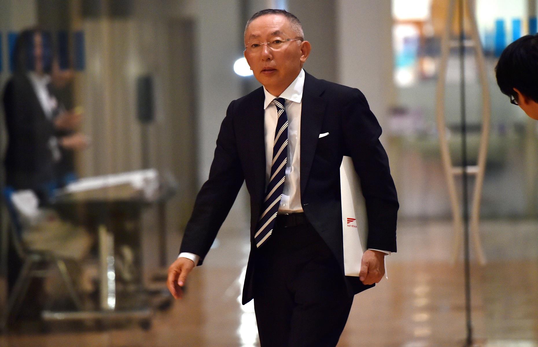 <p>Tadashi Yanai is the businessman behind Japanese fashion giant Fast Retailing, which is the parent company of brands including Uniqlo, Helmut Lang, and GU. As its flagship company, Uniqlo currently has around 2,400 locations in 25 countries, contributing to Fast Retailing's profits of $1.2 billion in the financial year ending August 2022. </p>  <p>Yanai, who has aspirations for Fast Retailing to become the largest retailer in the world, is married with two sons. He reportedly lives in a 16,586-square-foot mansion just outside Tokyo and owns two golf courses in Hawaii.</p>
