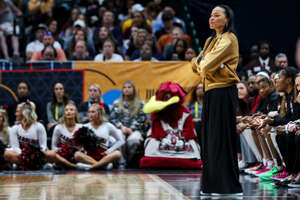 Mar 31, 2023; Dallas, TX, USA; South Carolina Gamecocks head coach Dawn Staley stands on the sideline in the game against the Iowa Hawkeyes in the first half in semifinals of the women's Final Four of the 2023 NCAA Tournament at American Airlines Center. Mandatory Credit: Kevin Jairaj-USA TODAY Sports