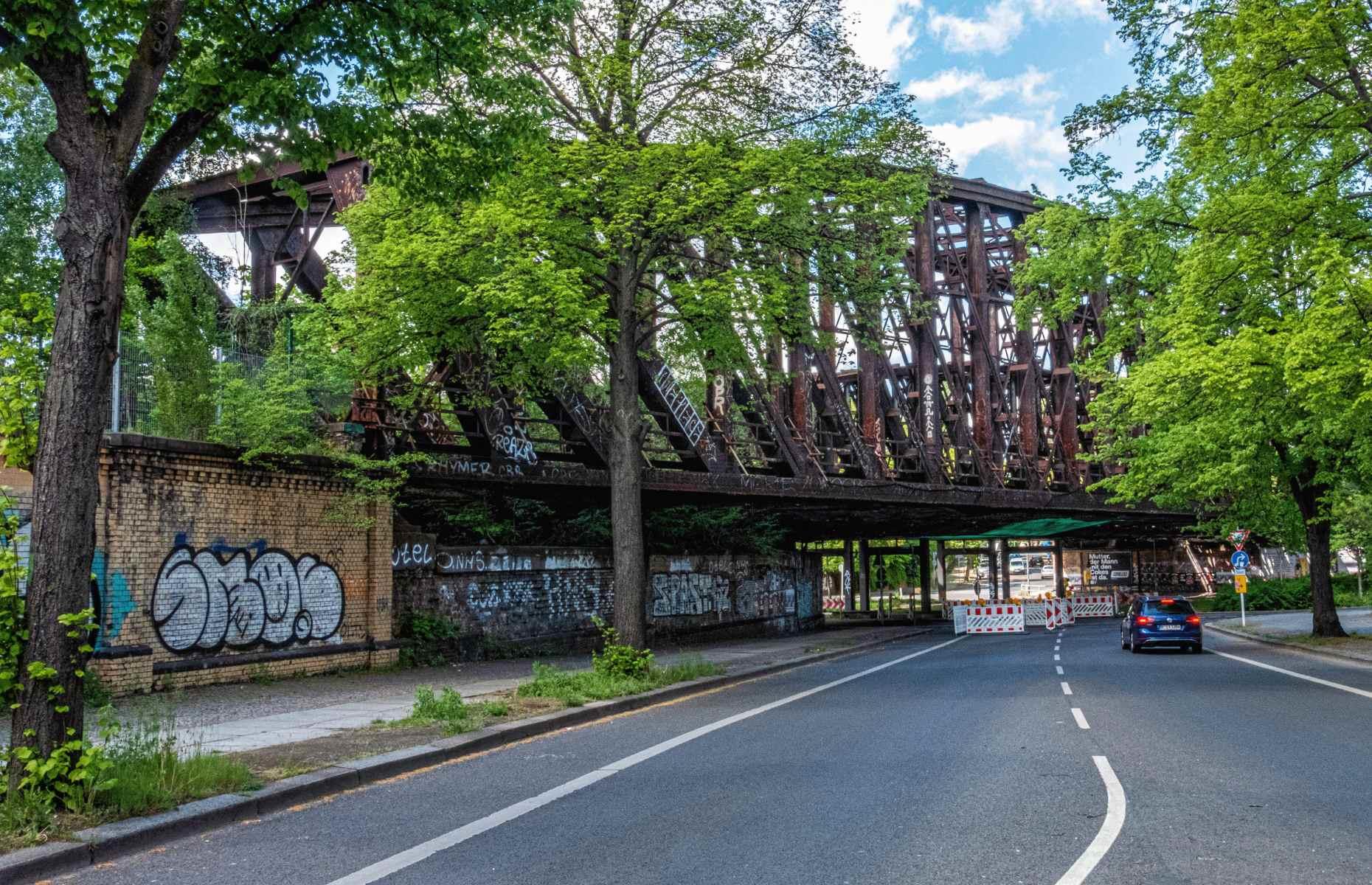 <p>Originally a network of four iron railway bridges constructed between 1890 and 1896, the Liesenbrücken now only count two in their number after the others were replaced with more contemporary overpasses in the mid-Fifties. The remaining couple, despite being protected monuments, have been left to rust without carrying a single train on their tracks for seven decades. They hang above a roundabout just north of Berlin’s city center. A planning application has been made in recent years, proposing the conversion of the largest bridge into a hotel.</p>